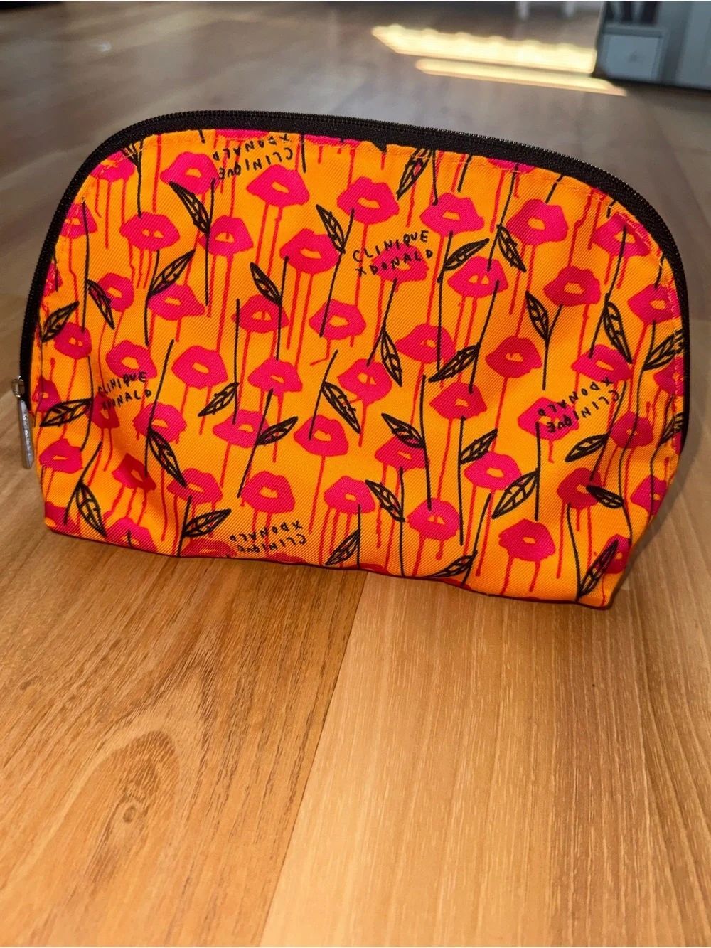 Clinique Orange Cosmetic Pouch with Pink Lip Print